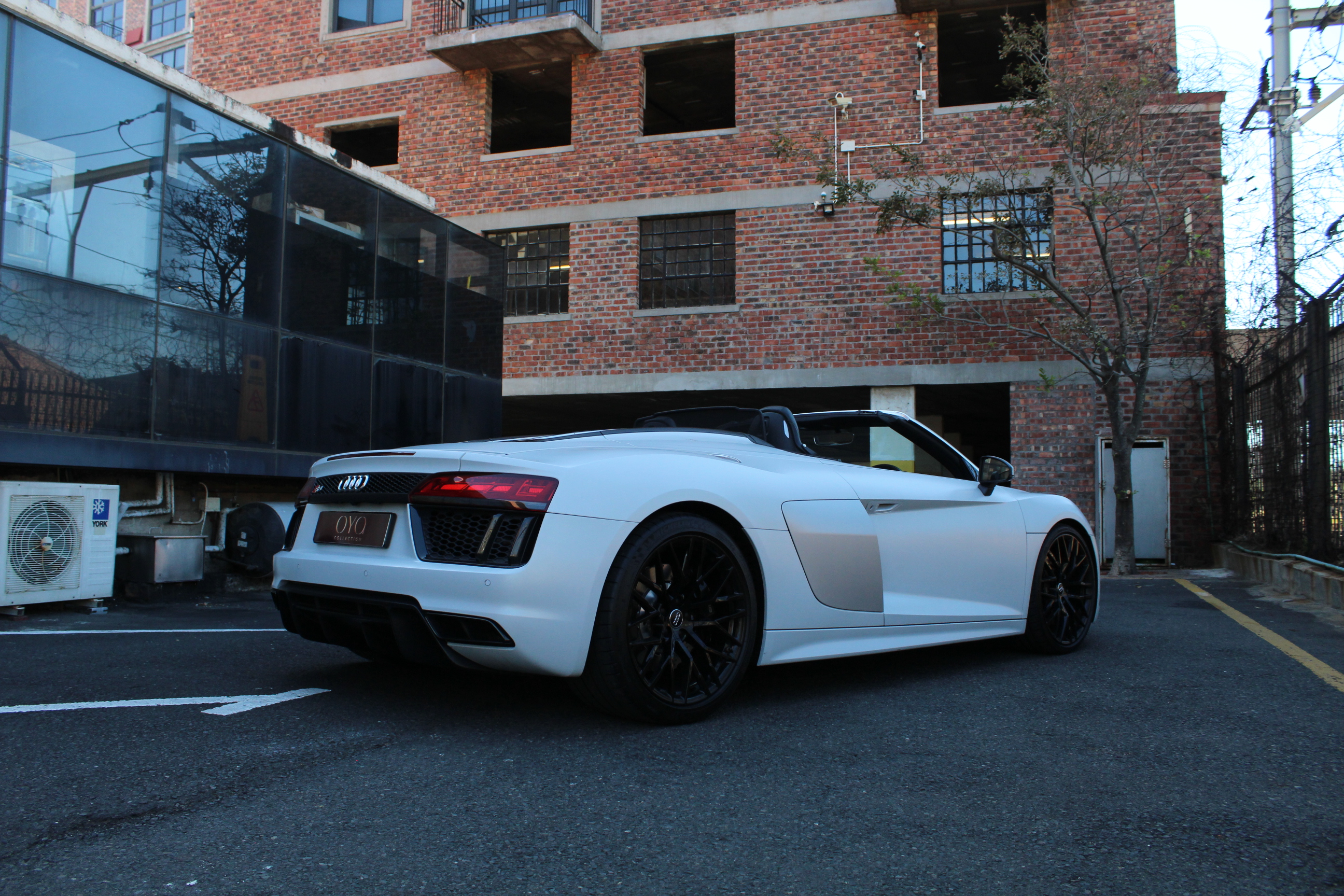 White 2019 Audi R8 Spyder V10 Convertible parked outdoors.