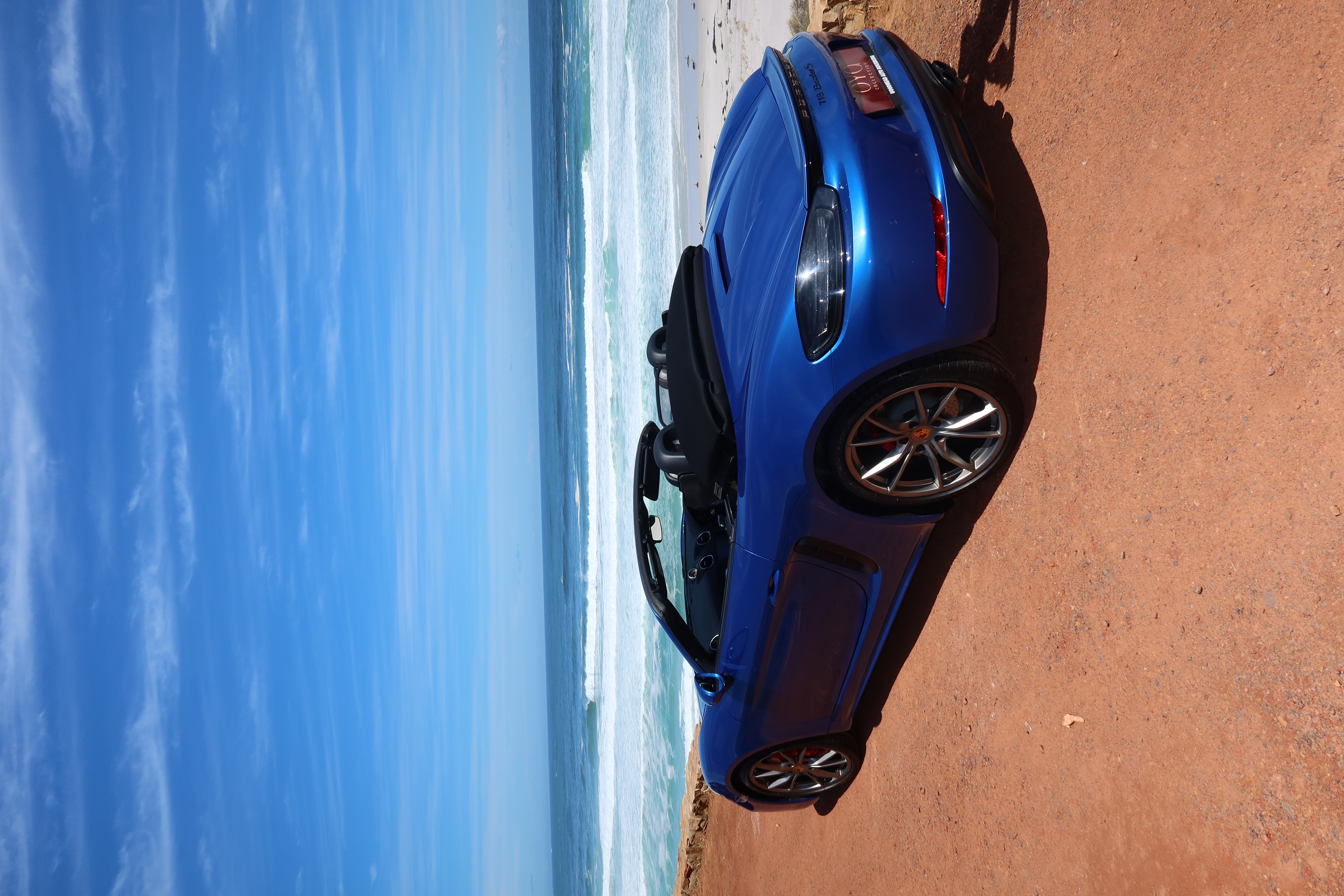 Blue 2017 Porsche Boxster 718 S side profile for hire in Cape Town.