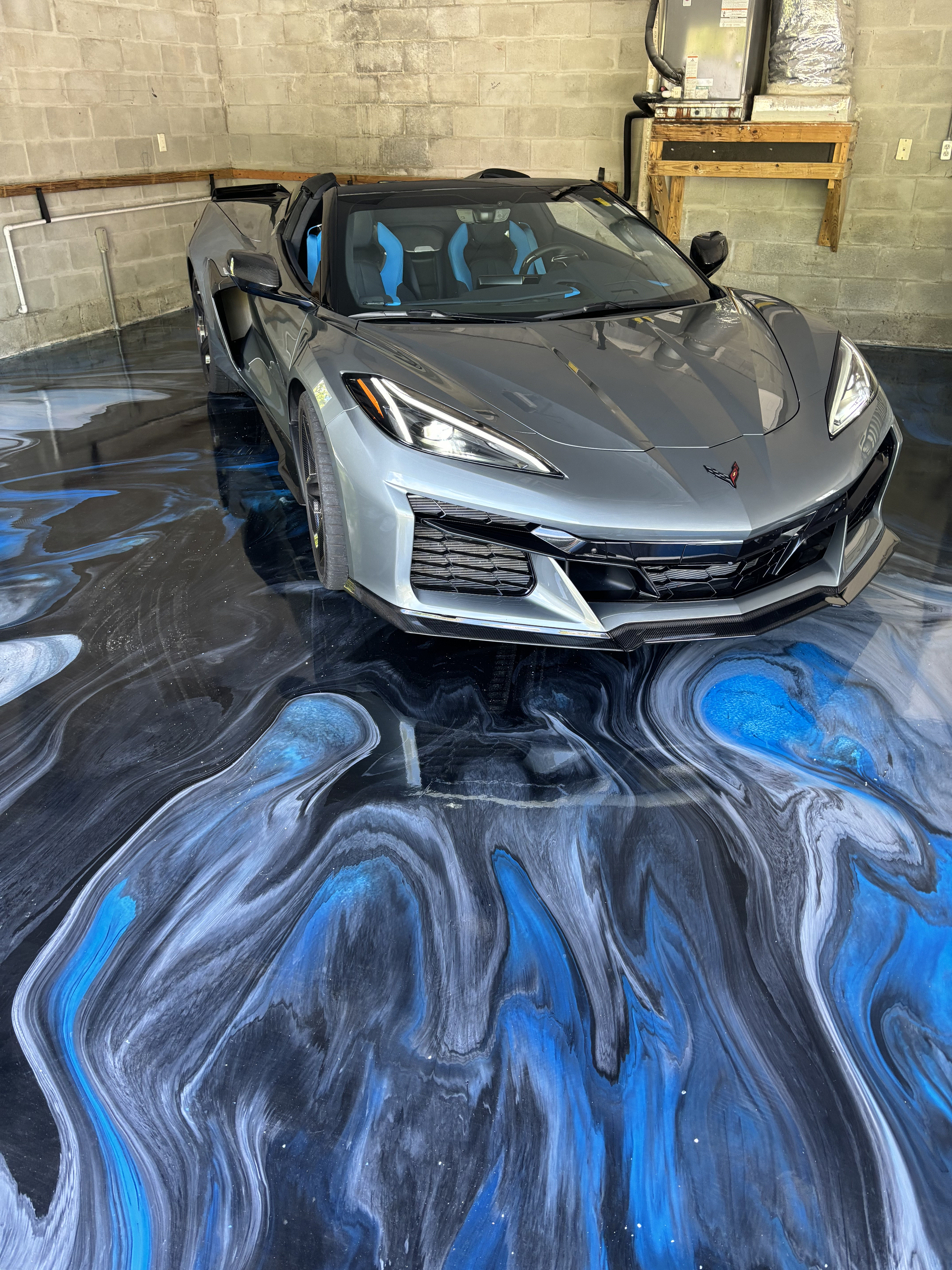 Ocean-blue metallic epoxy garage floor by SAC Epoxy Flooring