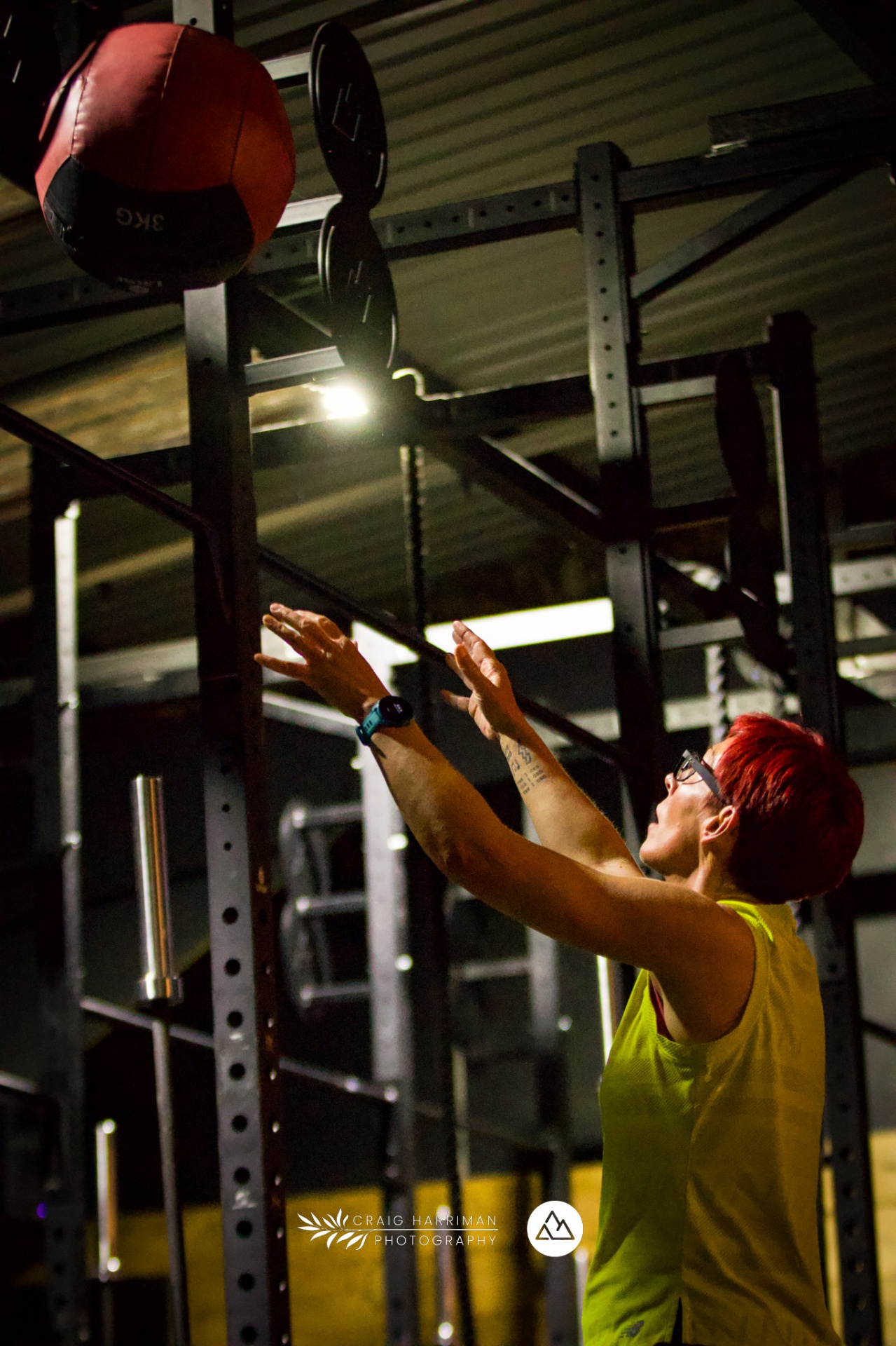 Woman building functional strength with a wall-ball workout at Glacier