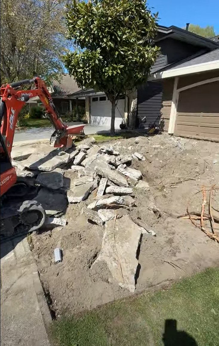 Broken pieces of an old concrete driveway removed and hauled away in Steveston, Richmond BC