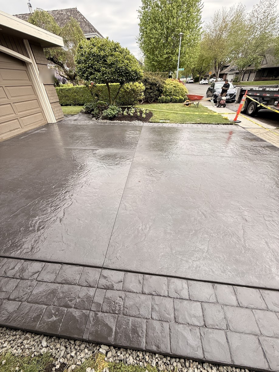 Finished stamped concrete driveway running toward the street in Steveston, Richmond BC