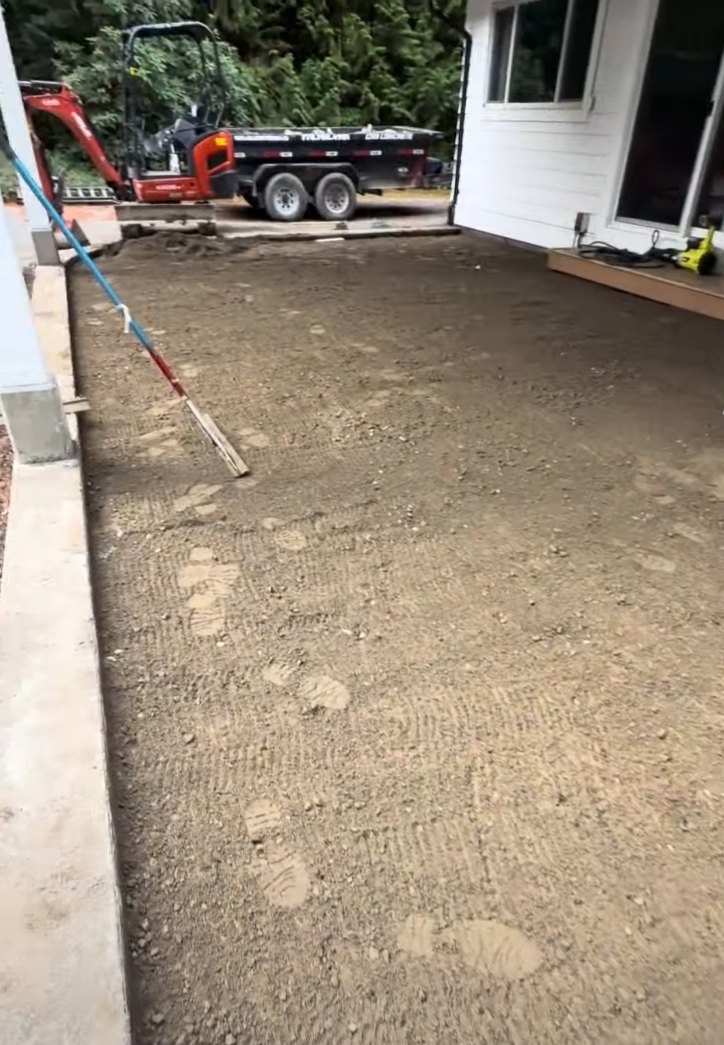 Graded and compacted base prep for a new stamped concrete patio in Surrey BC