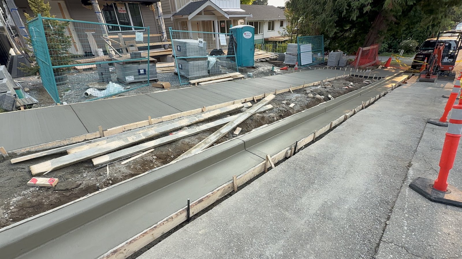 Fresh sidewalk and curb with forms still in place in the City of North Vancouver