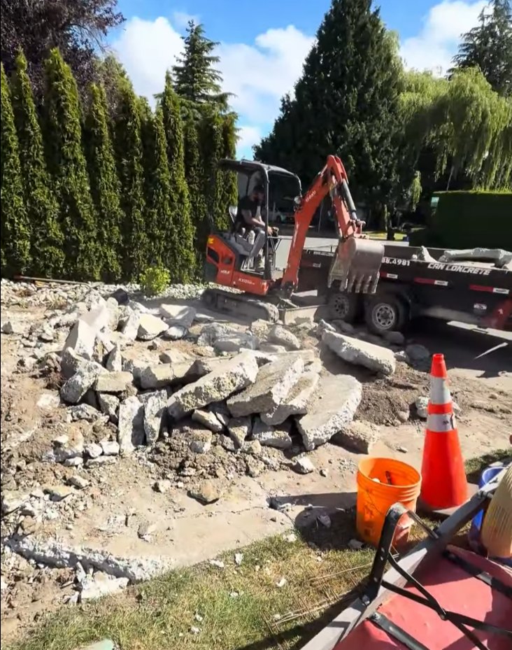 Old concrete hauled onto a trailer during driveway demolition in Steveston, Richmond BC
