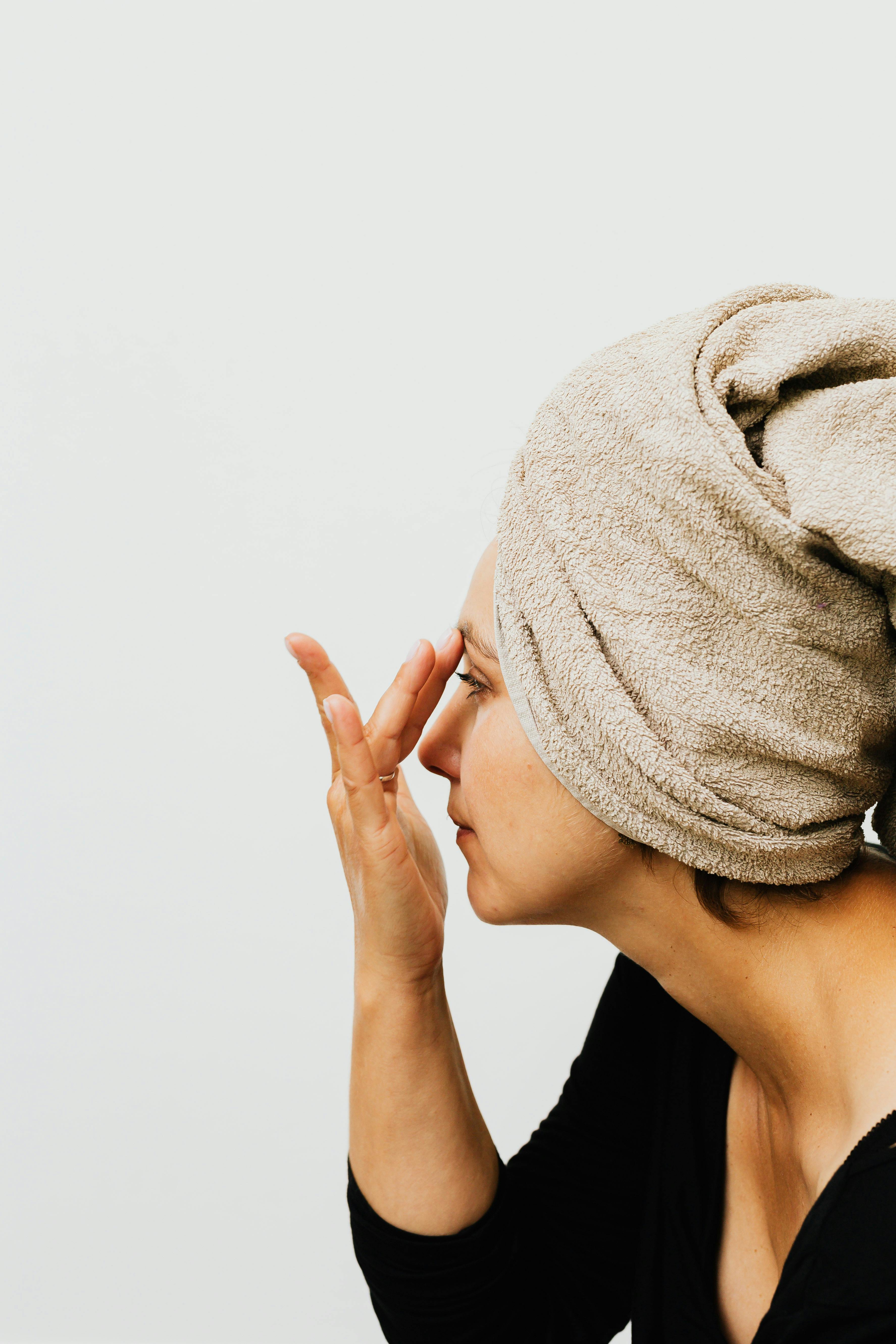 Woman applying skincare