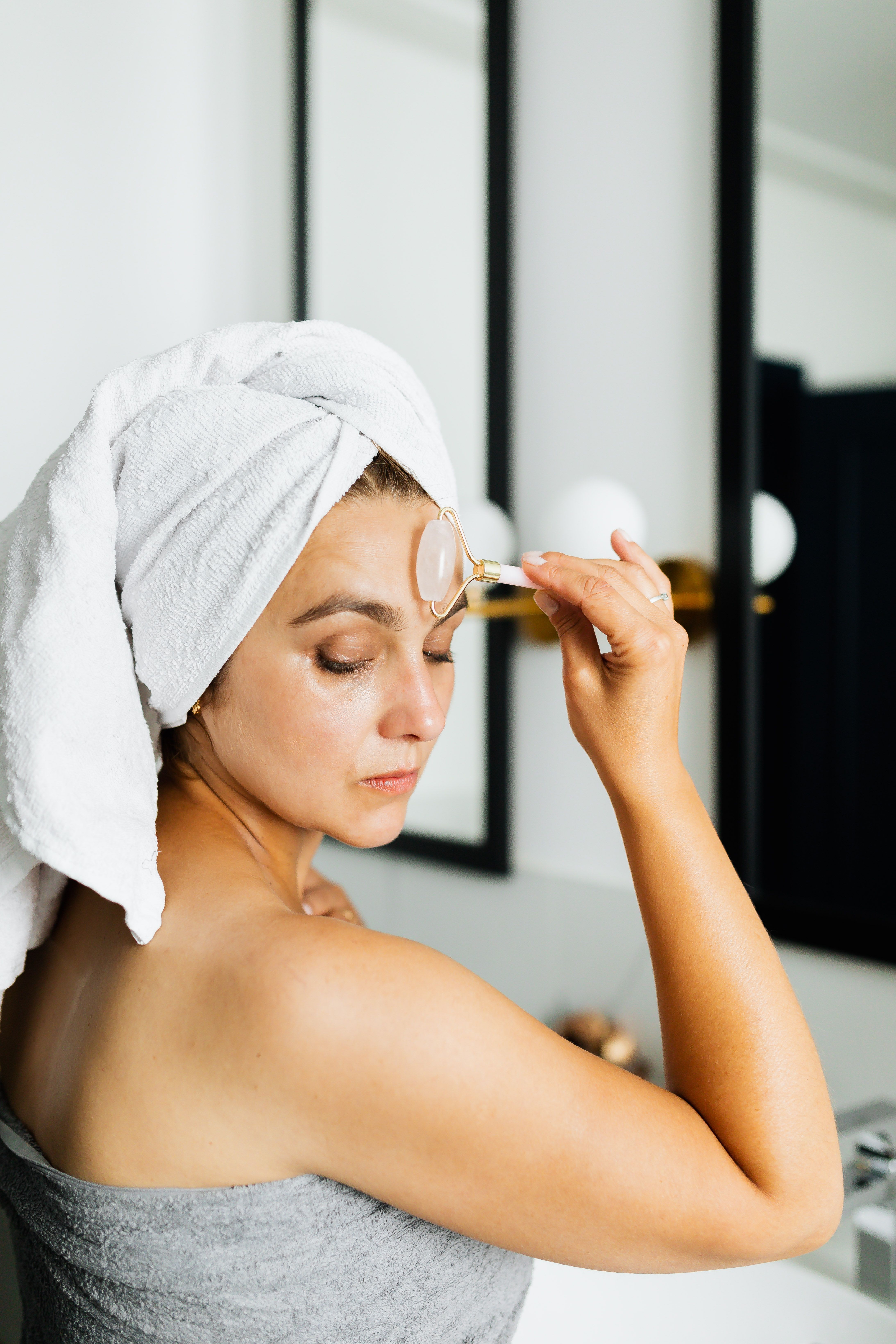 Woman using face roller