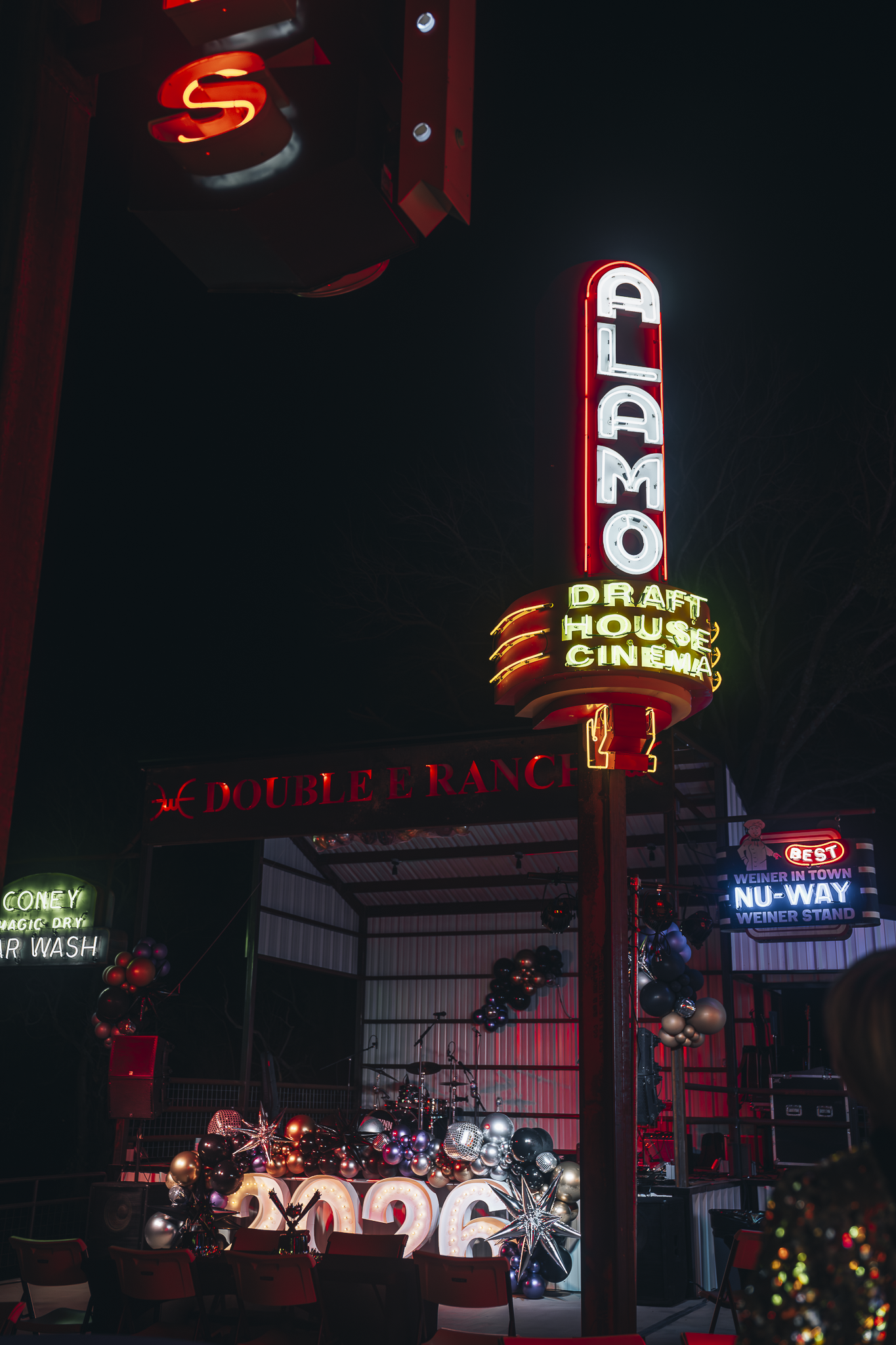 Double E Ranch & Venue illuminated sign and outdoor cinema setting.