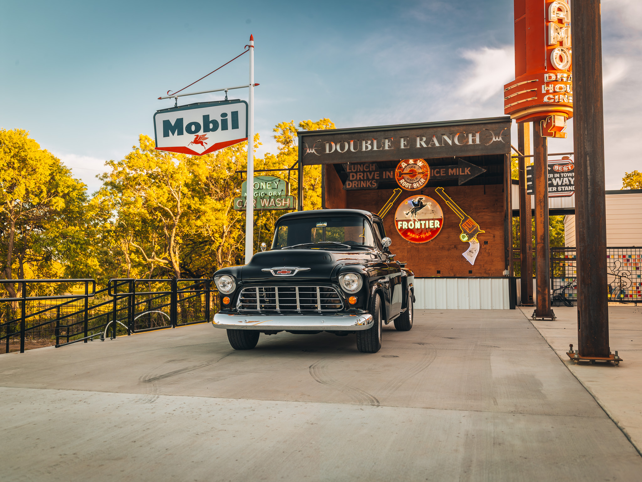 Double E Ranch & Venue entrance with vintage car and retro signage, showcasing Texas lifestyle