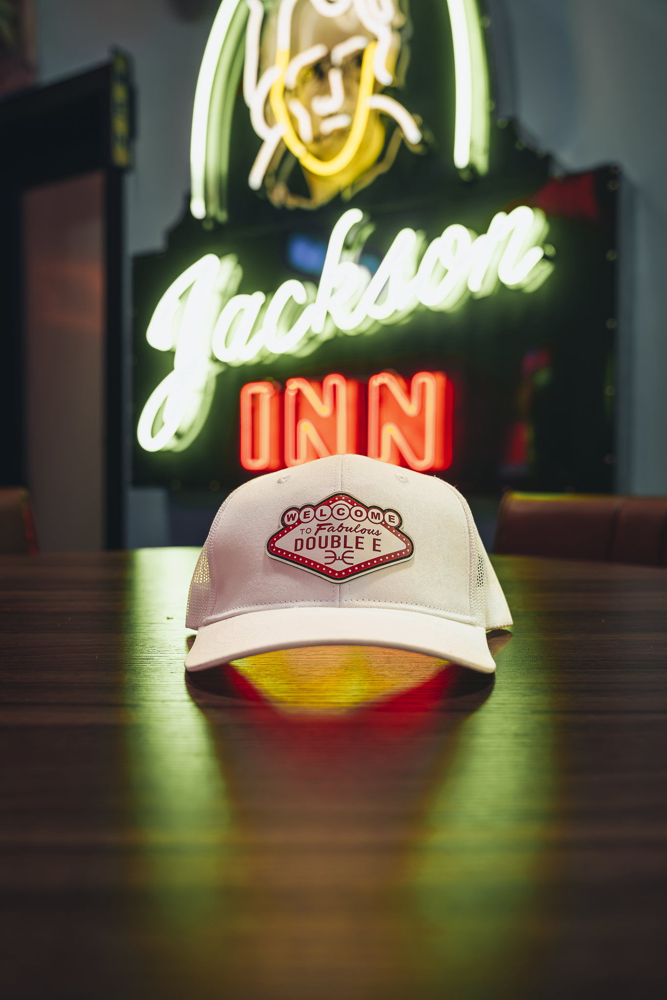 Double E Lifestyle branding and Jackson Inn neon sign, showcasing Texas experiences.