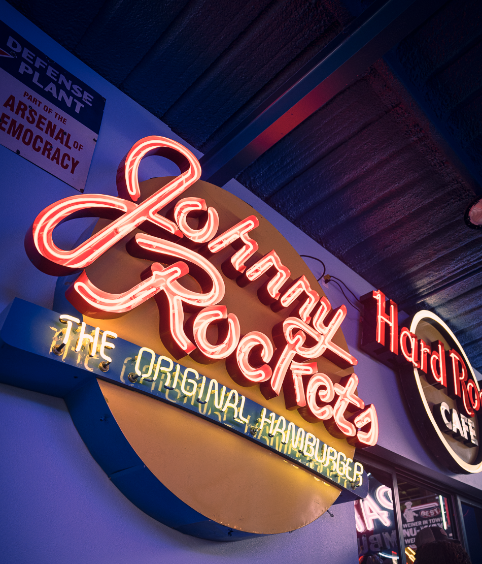 Johnny Rockets neon sign and cafe showcasing Double E Lifestyle experiences in Texas.