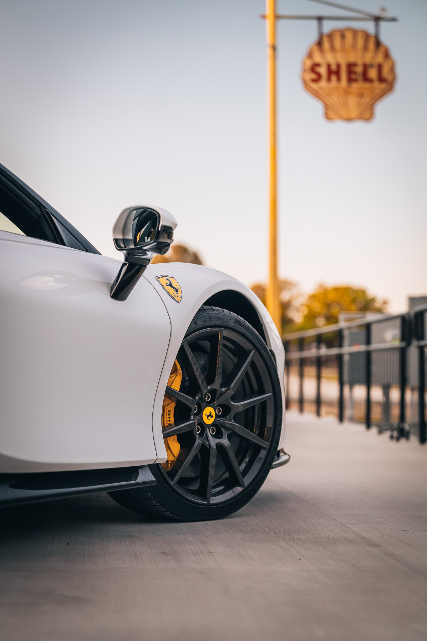 Ferrari and Shell signage, showcasing Double E Lifestyle experiences in Texas.