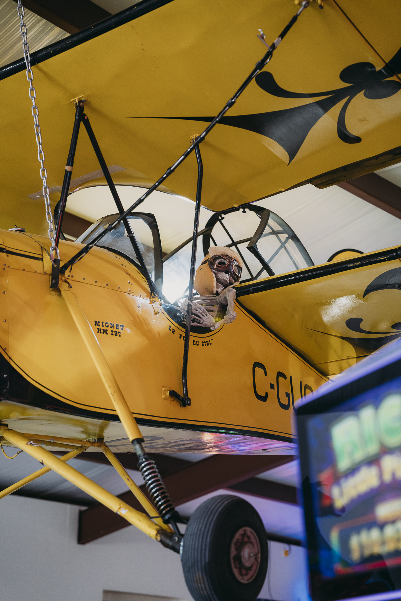 Vintage yellow airplane display at Double E Lifestyle venue in Texas.