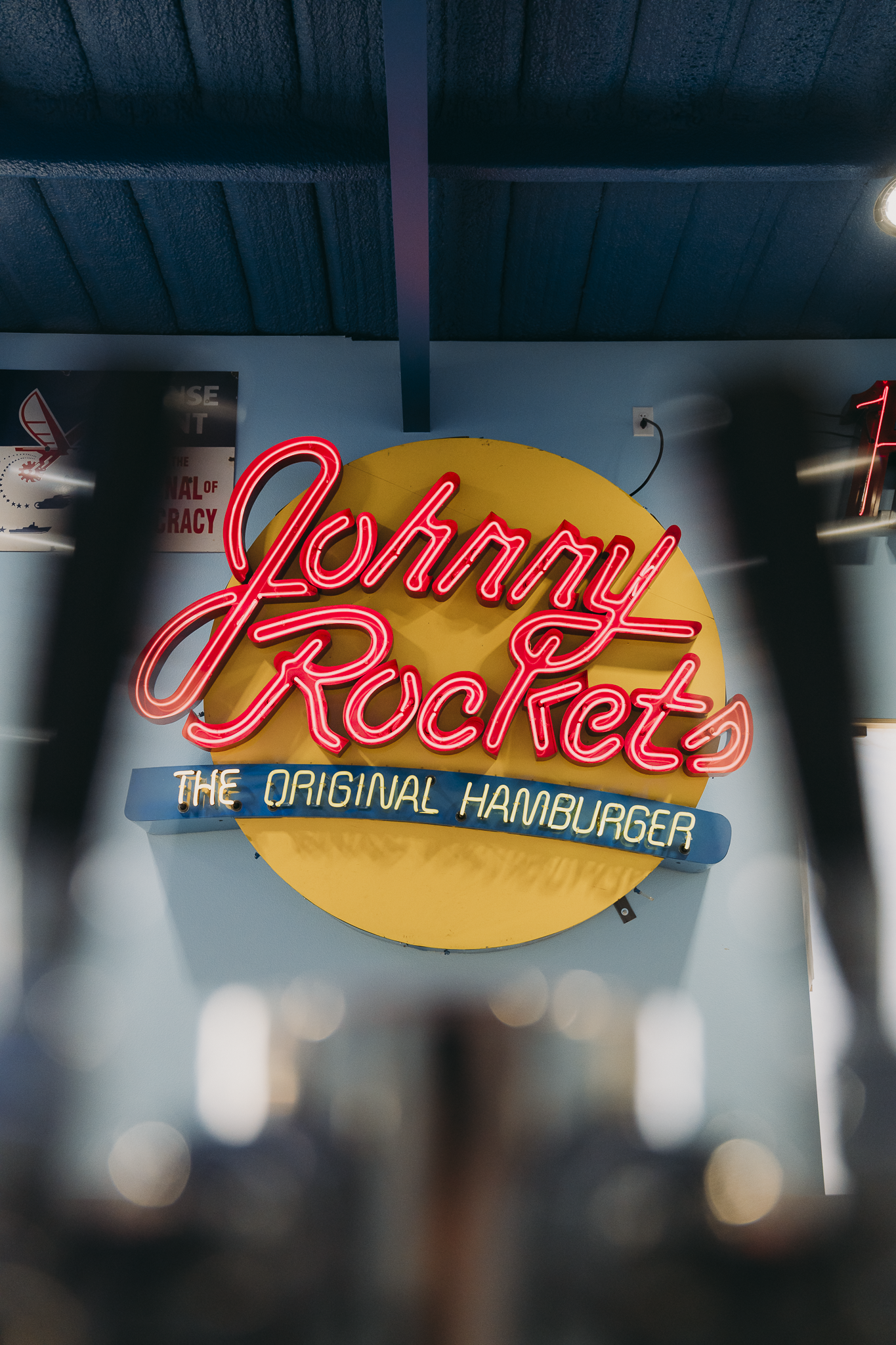 Double E Lifestyle venue featuring Johnny Rockets neon sign and the original hamburger branding.