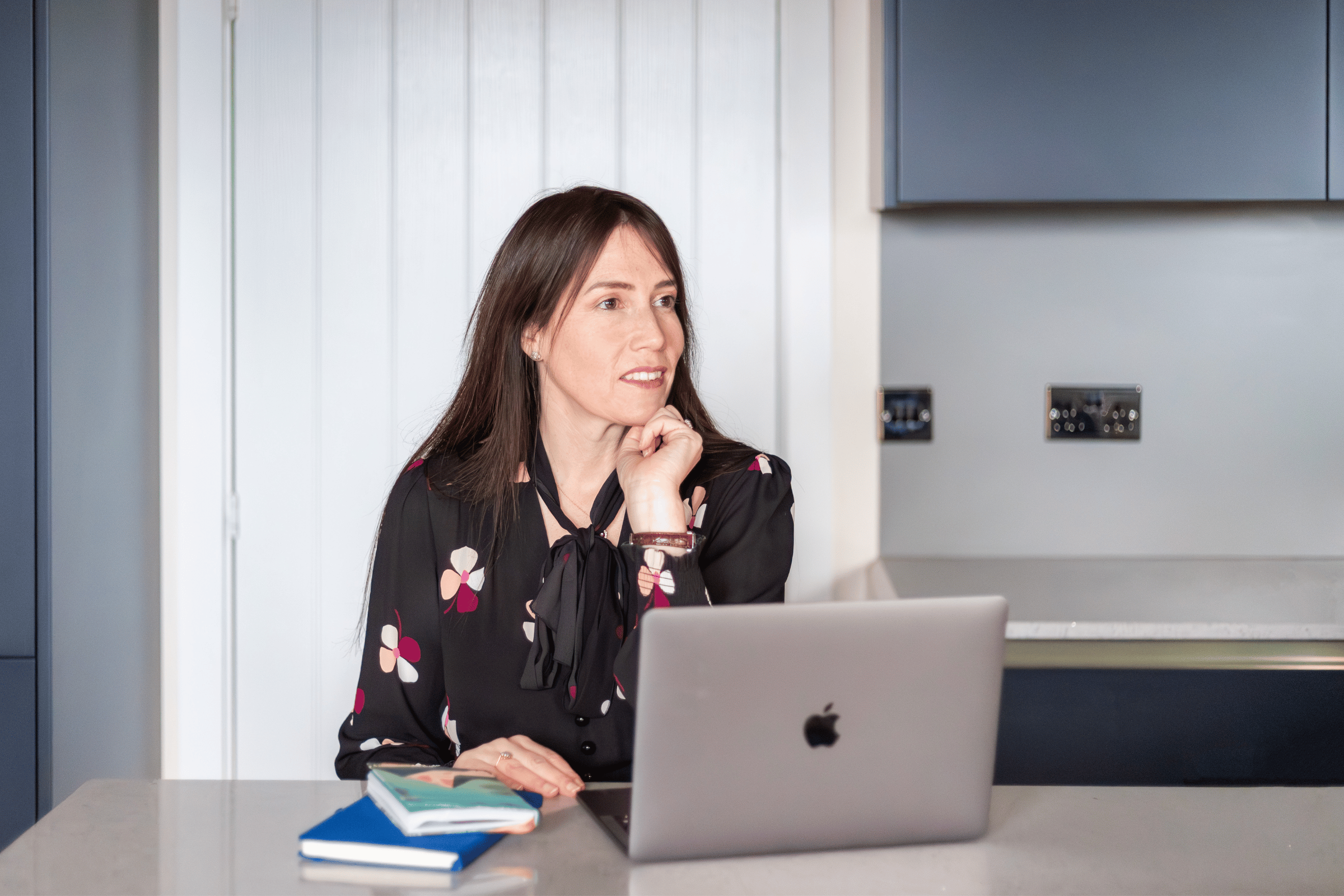 lady with laptop thinking