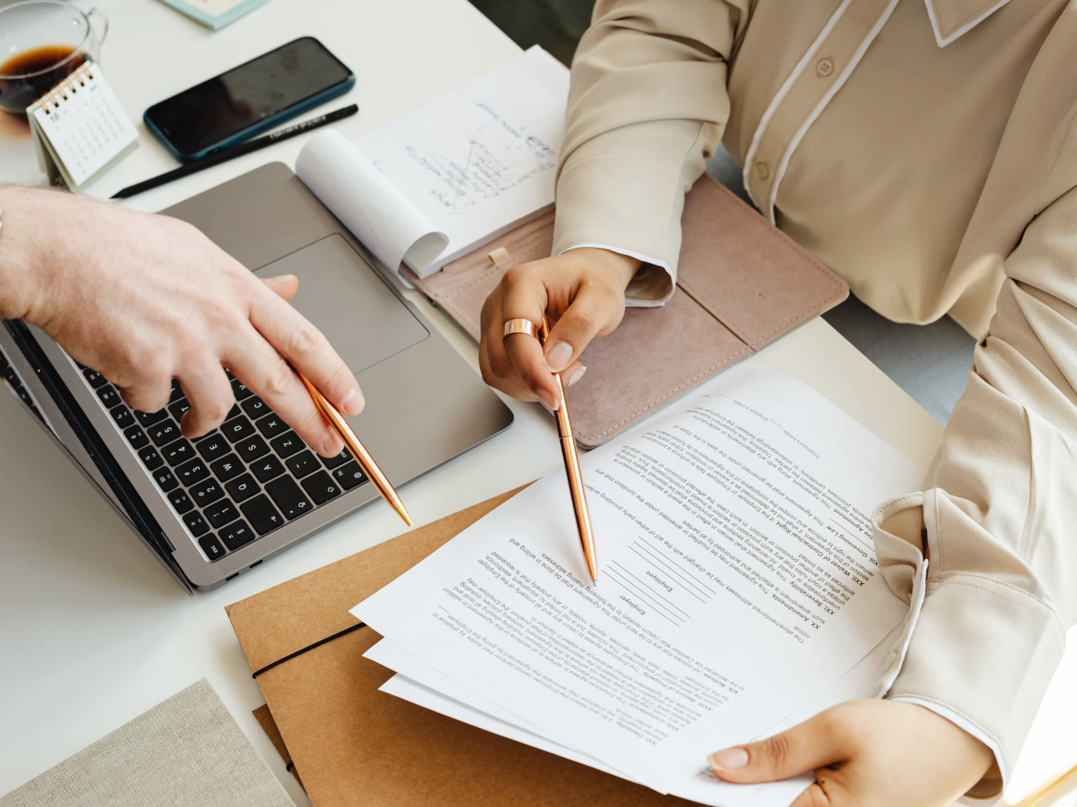 Homeowners reviewing printed property documents and planning next steps