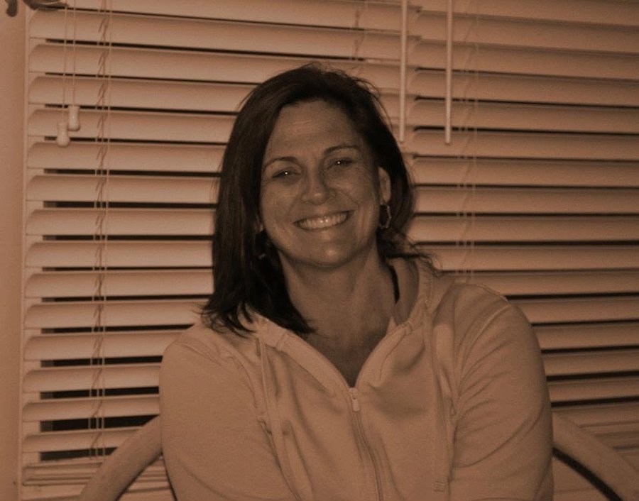 Mary smiling, in a sepia-toned photo