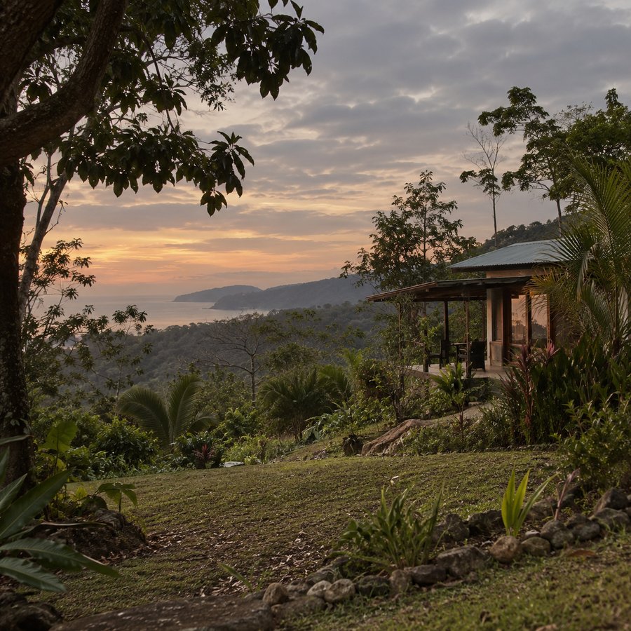 Sunset over the ocean from a hillside casita surrounded by tropical gardens in Costa Rica