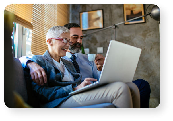 Couple reviewing finances on laptop