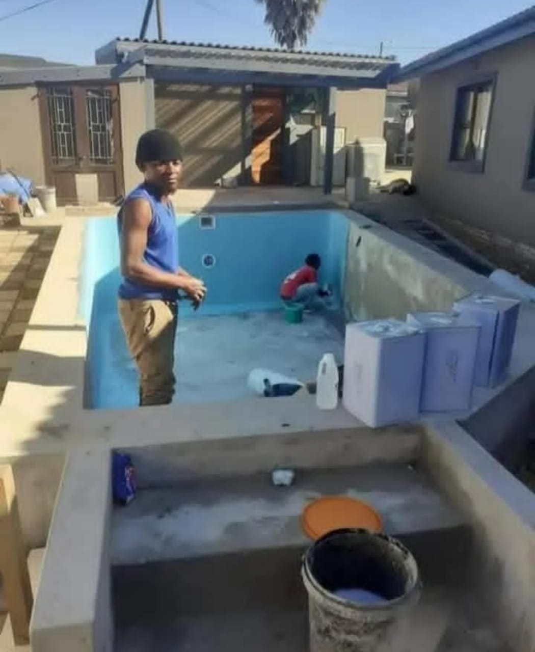 Swimming pool renovation team at work