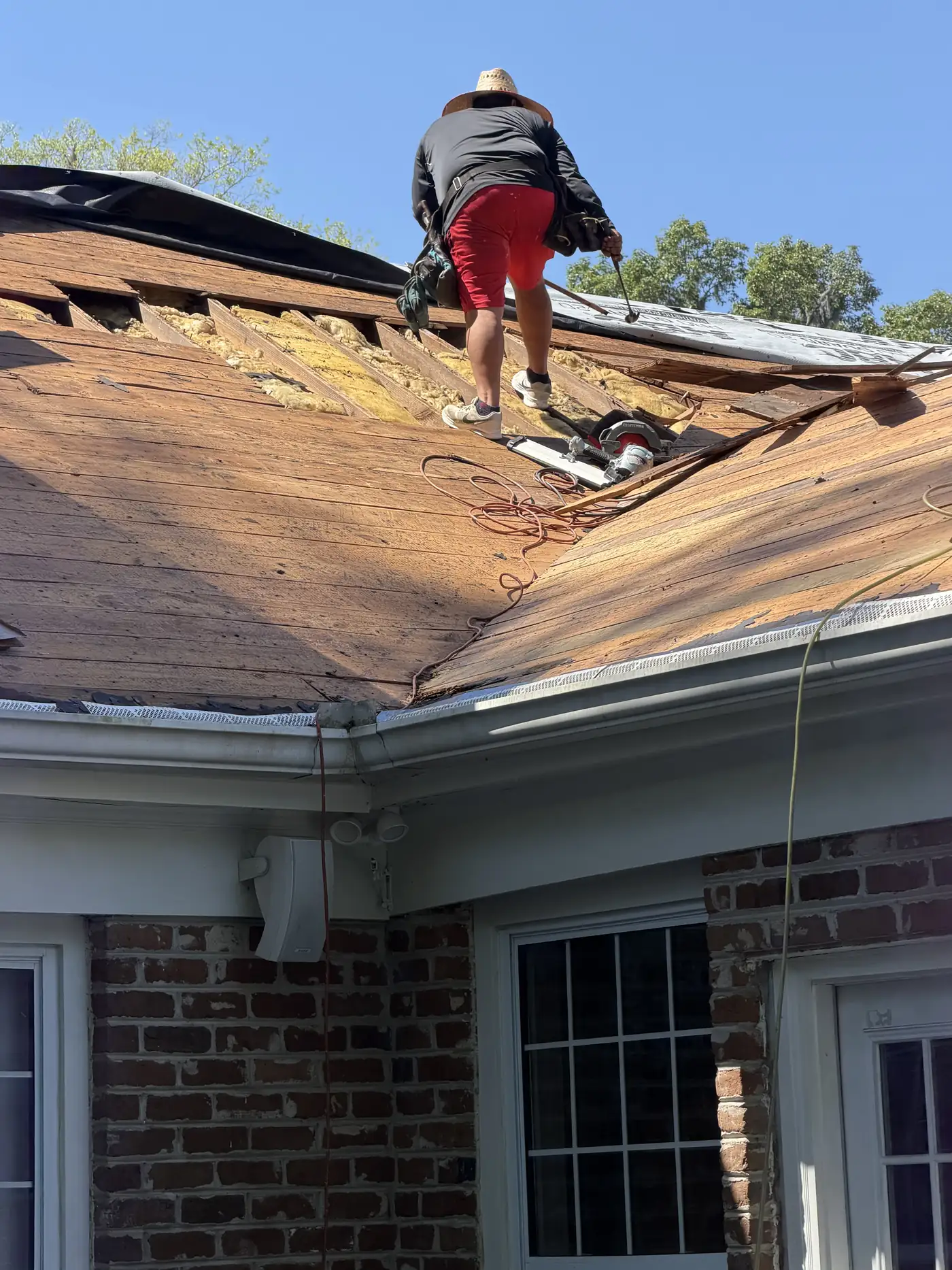 New pipe boot and flashing set into shingles during a roof repair