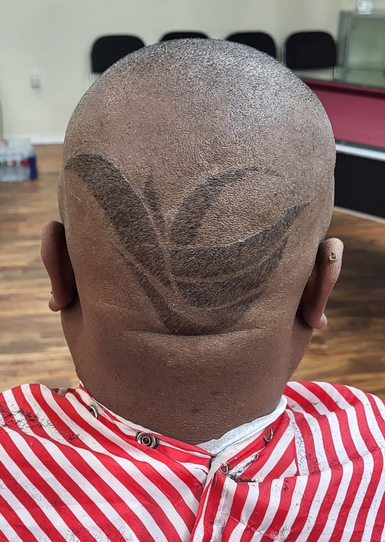 Freehand leaf design cut into the back of a close shave