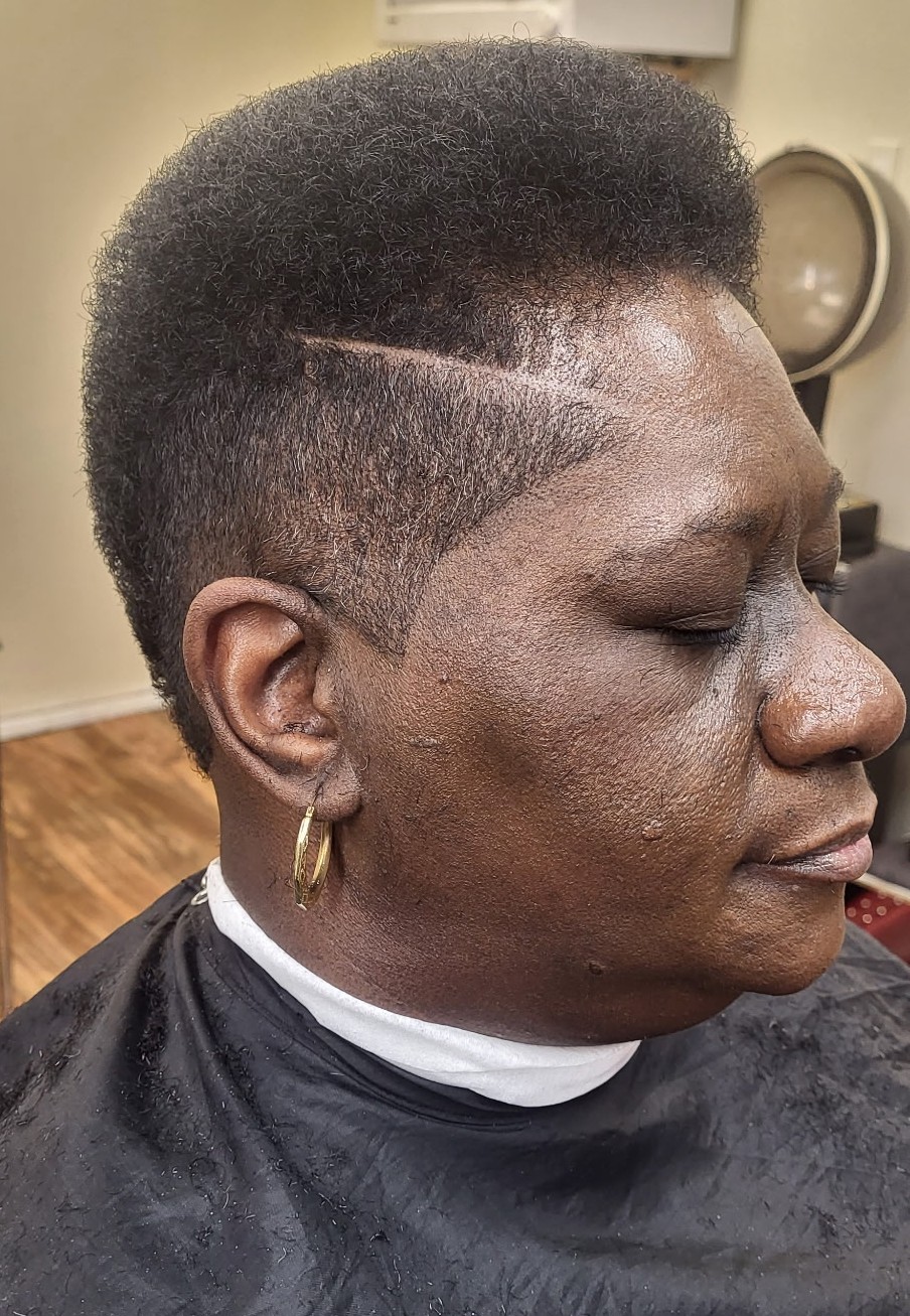 Women&rsquo;s short tapered cut with a shaved part line