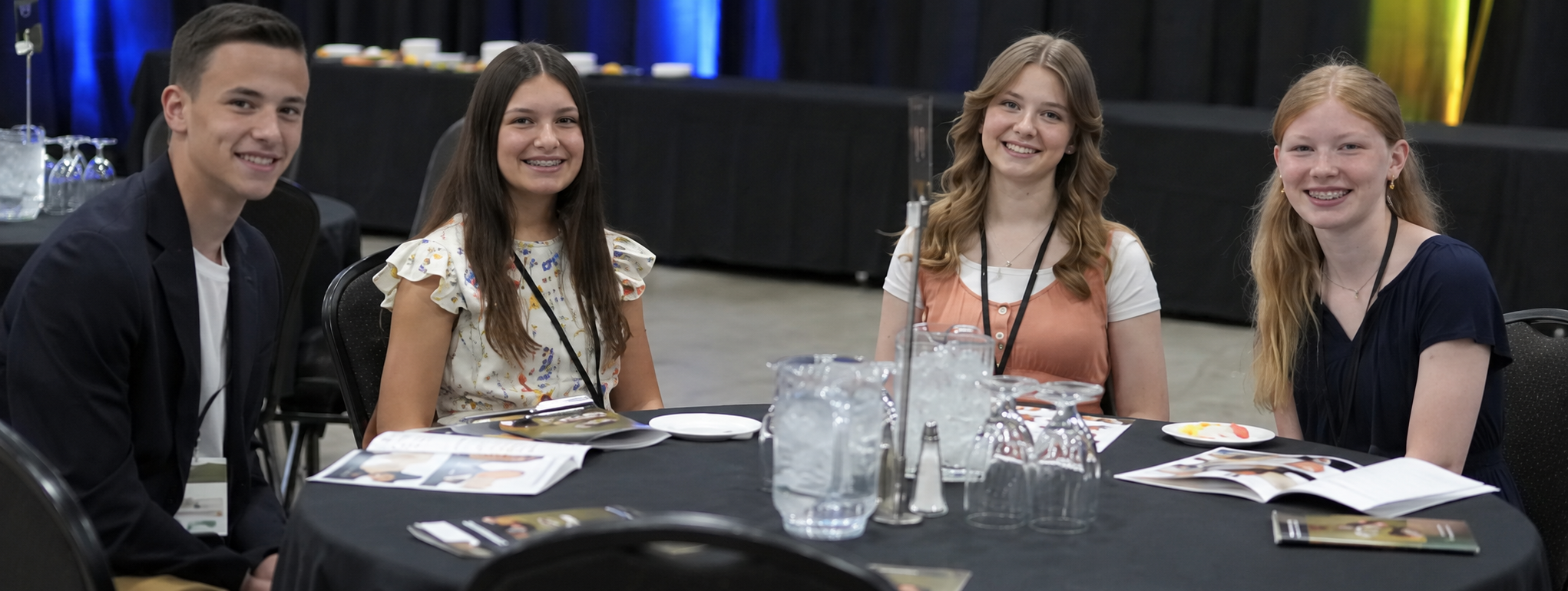 Four young people seated together at a Christian leadership event