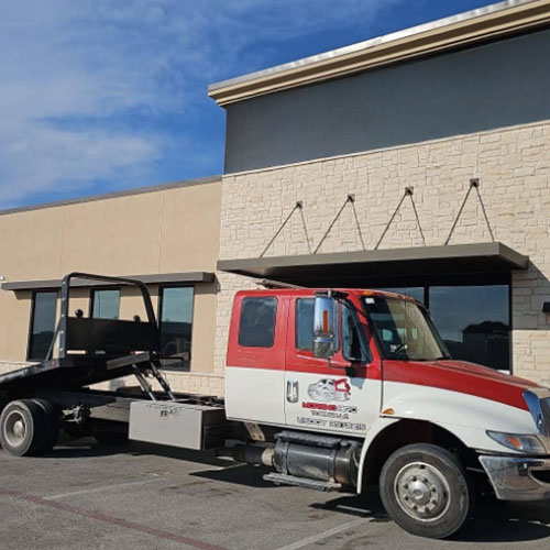 Heavy-duty tow truck helping large vehicle in Odessa, TX