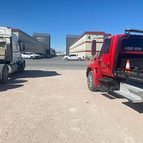 Heavy-duty tow truck handling commercial vehicle in Big Spring, TX