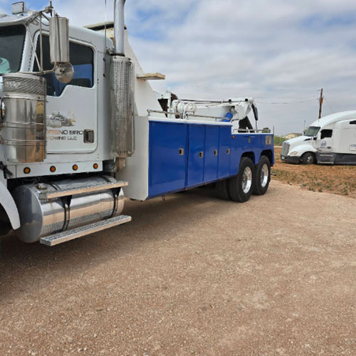 Emergency towing crew recovering large vehicle in West Odessa, TX