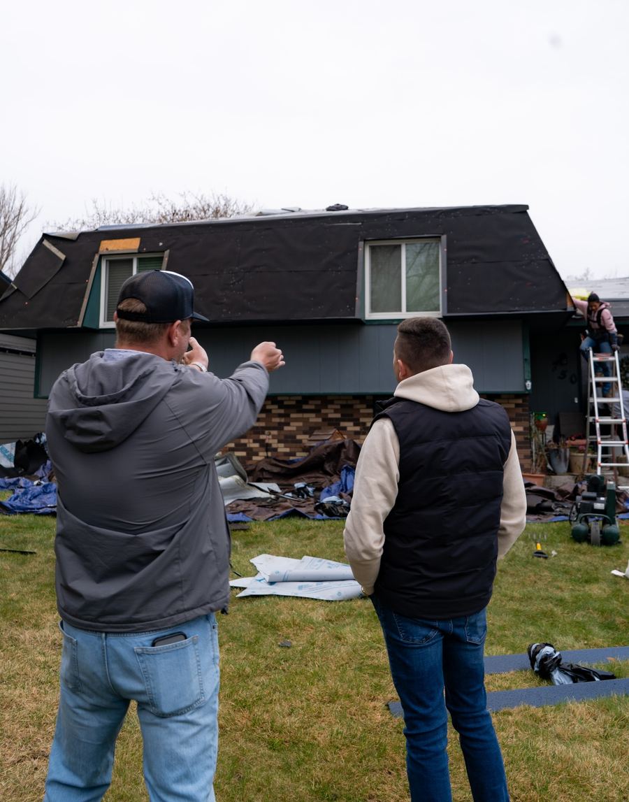 A Great White advisor talking through a roof with a homeowner