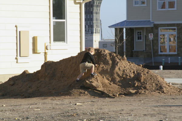 Young Michael Sears climbs a dirt pile at the site where his uncle's home was being built Young Michael Sears climbs a dirt pile at the site where his uncle's home was being built