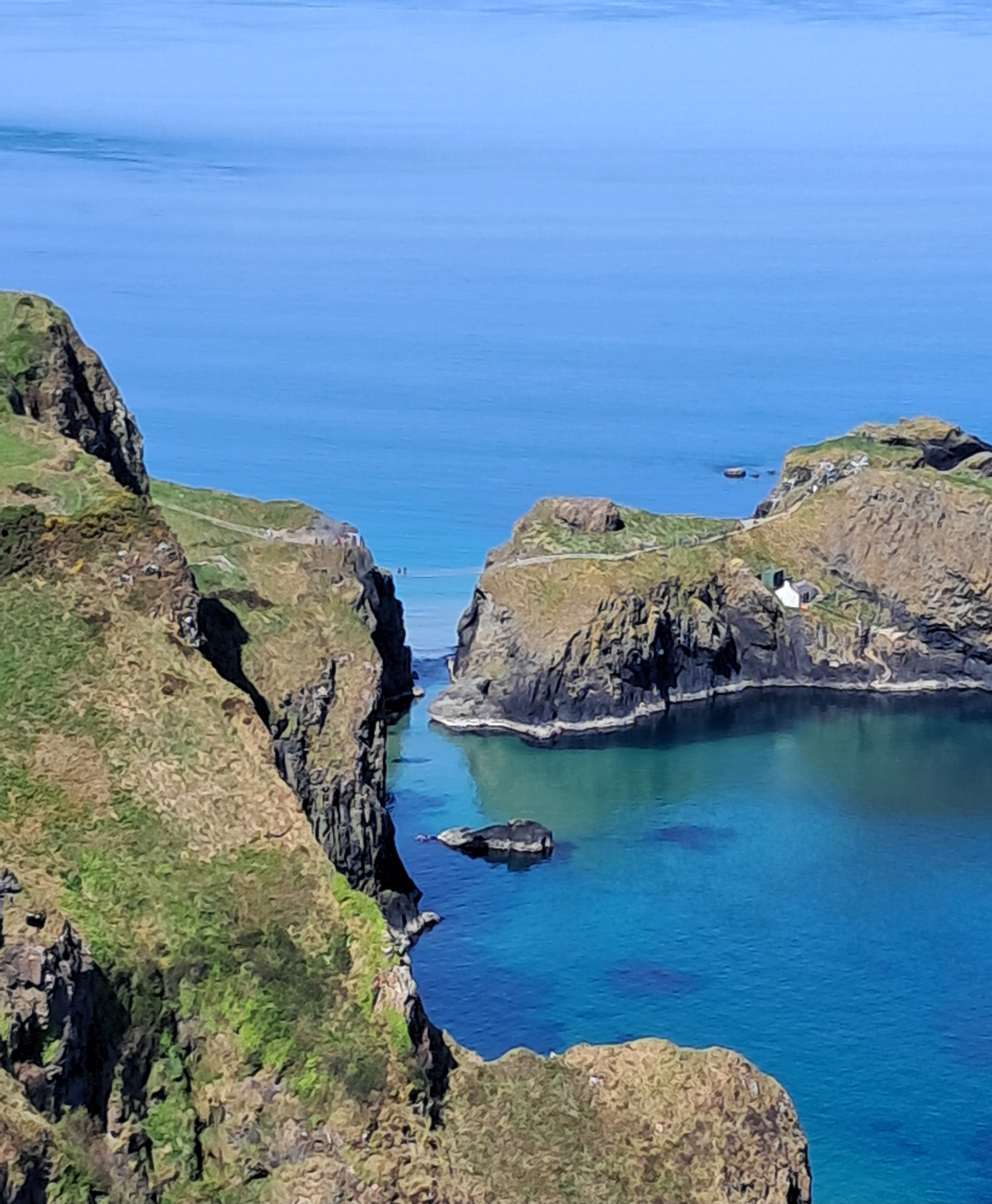 Carrick-a-Rede island and surrounding blue sea