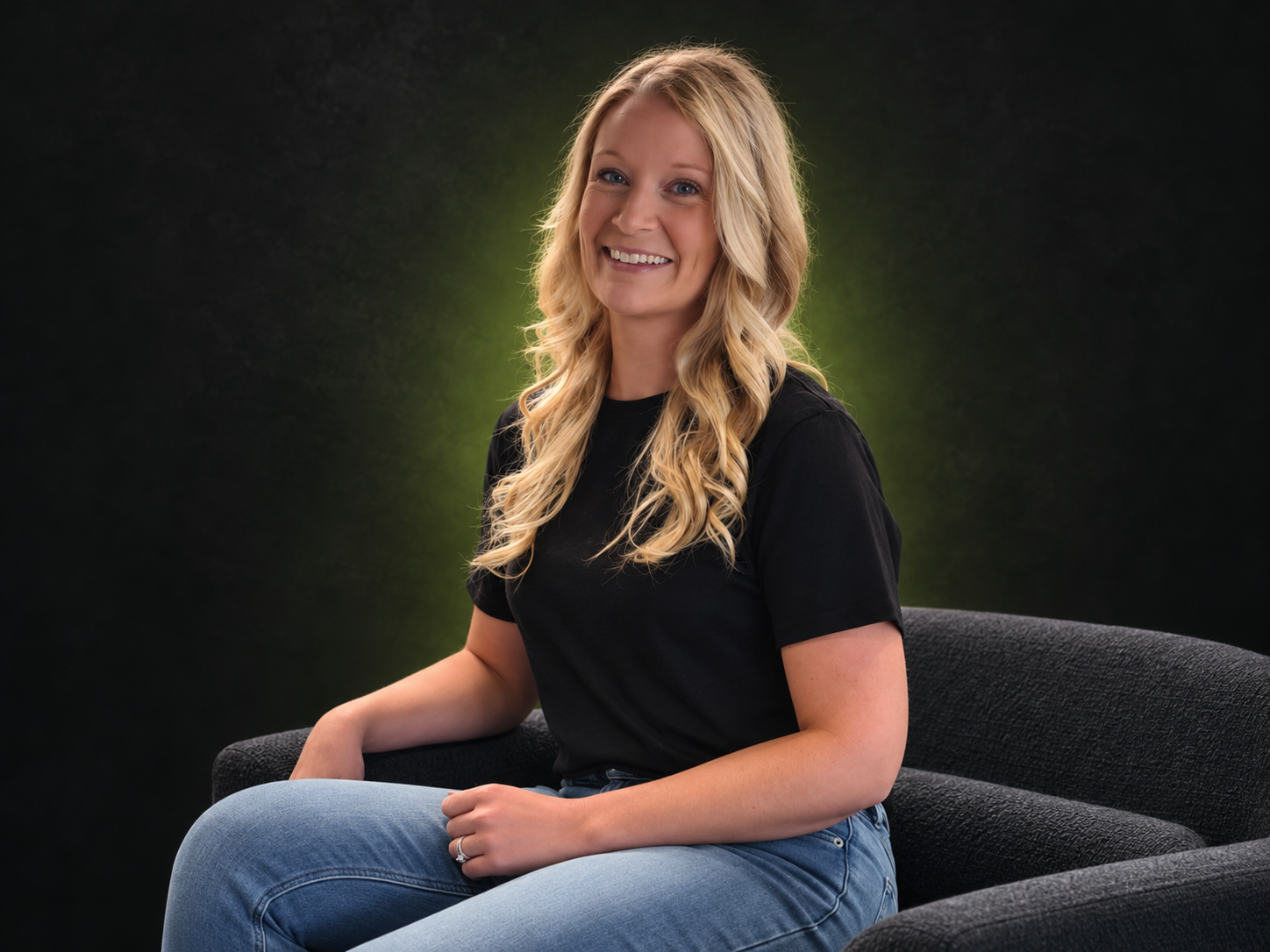Tiffany Greenhalgh portrait with a branded dark background