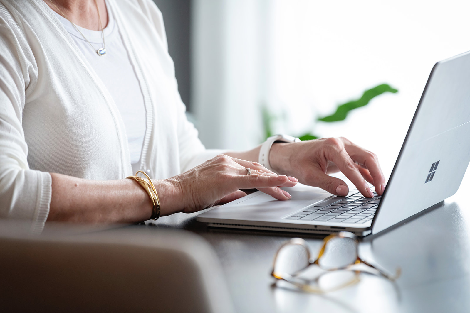 Woman at desk typing