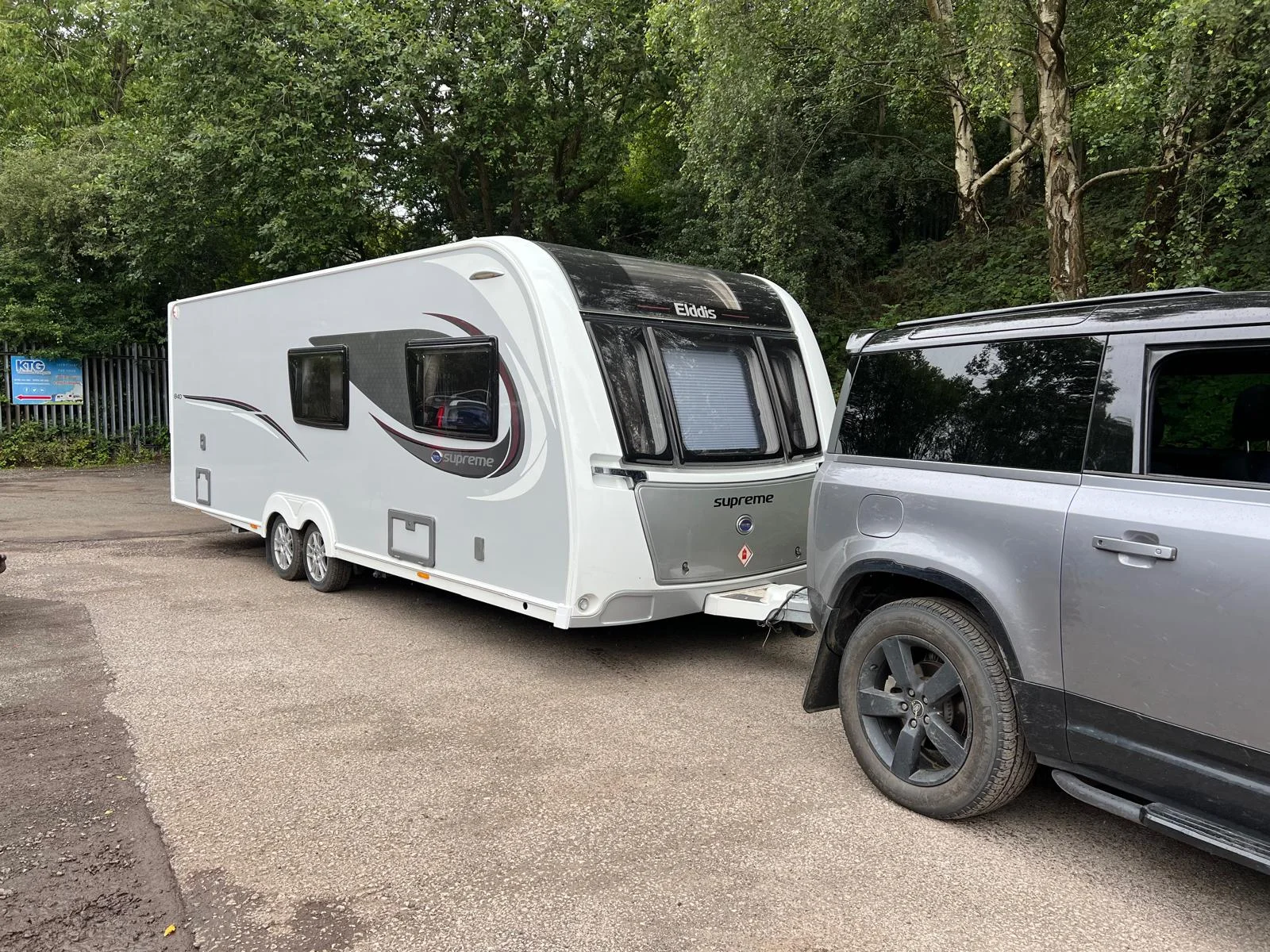 Elddis Supreme touring caravan hitched to a 4x4 in the KTG yard
