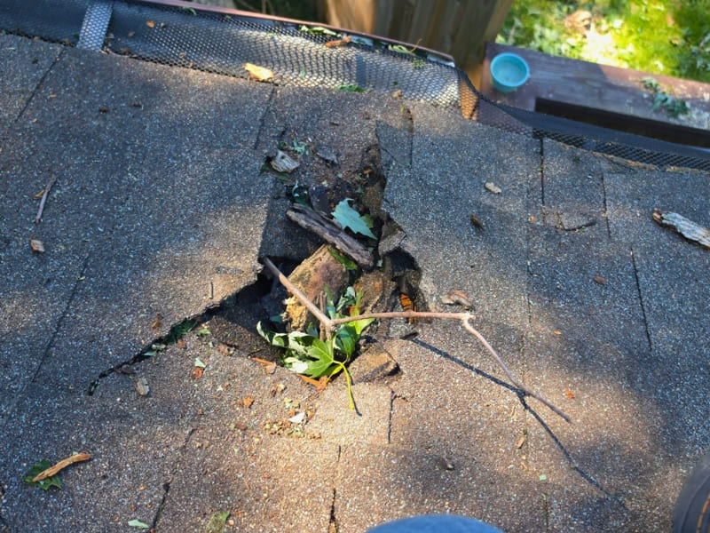 Damaged roof flashing around a chimney