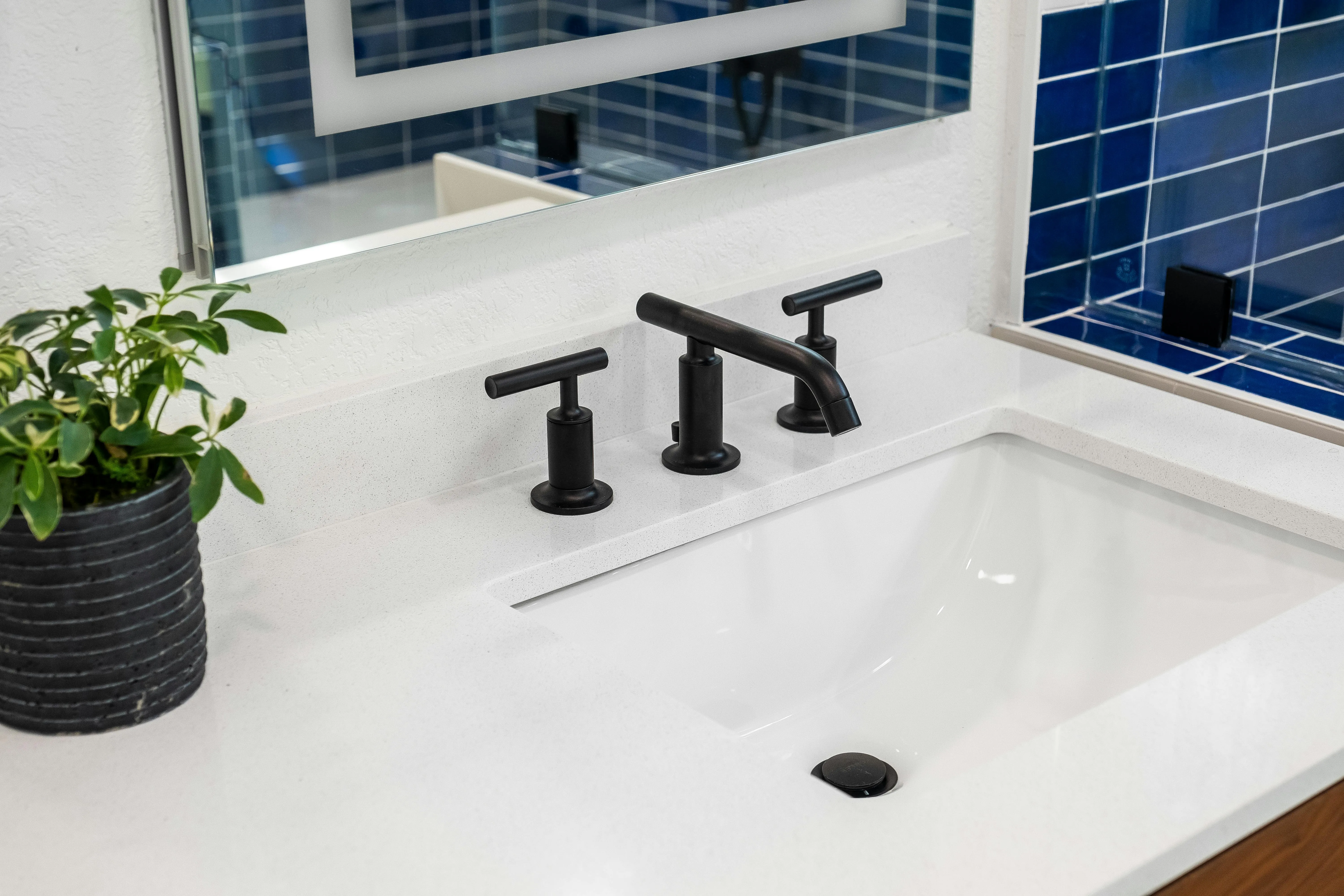 LUXPRO Plumbing technician installing bathroom fixtures on Long Island