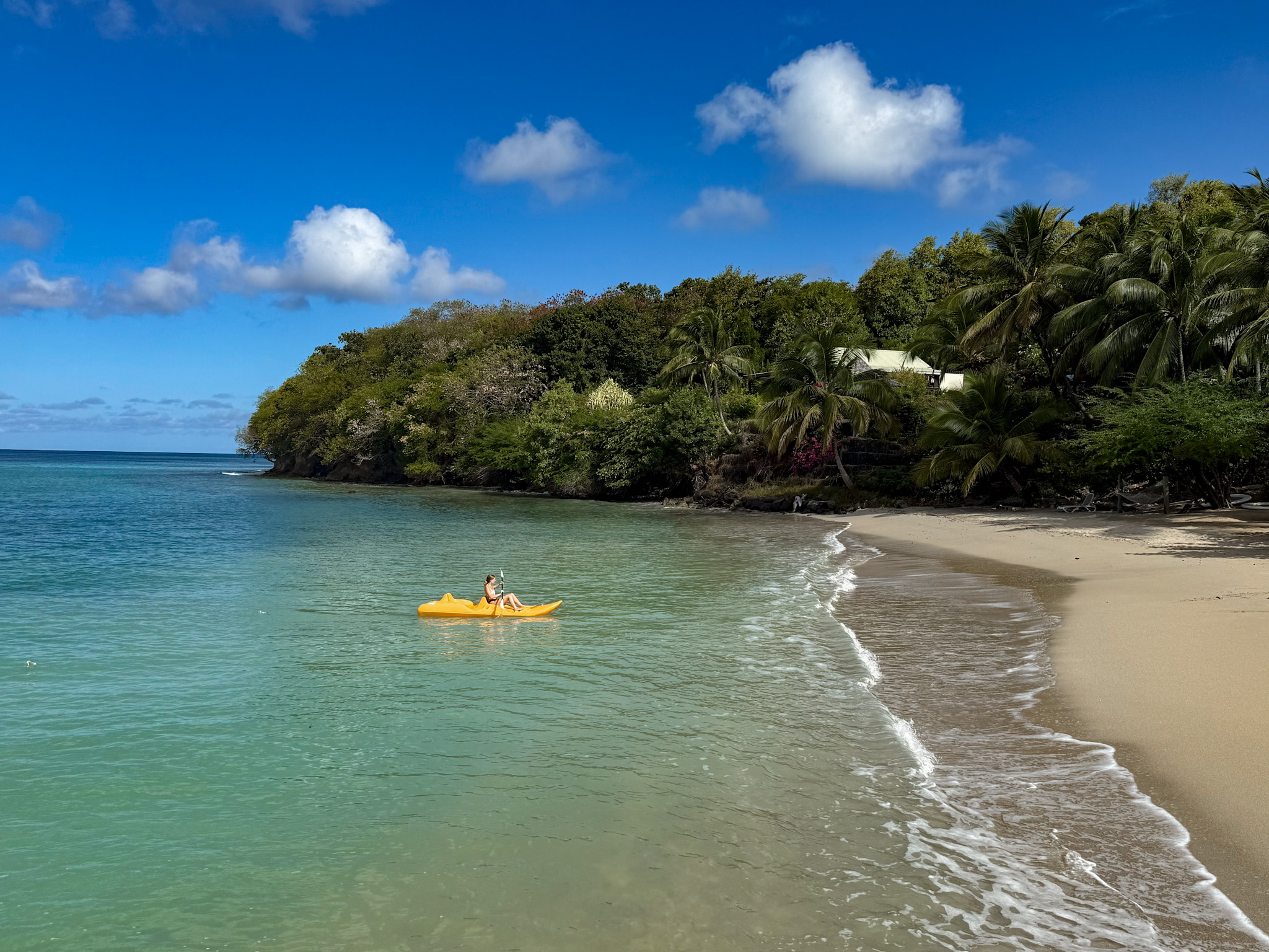 girl kayaking at calabash cove in saint lucia girl kayaking at calabash cove in saint lucia