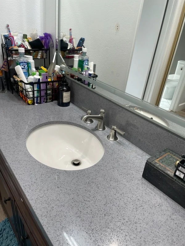 CH Cleaning Services — Bathroom vanity, mirror, and toiletries