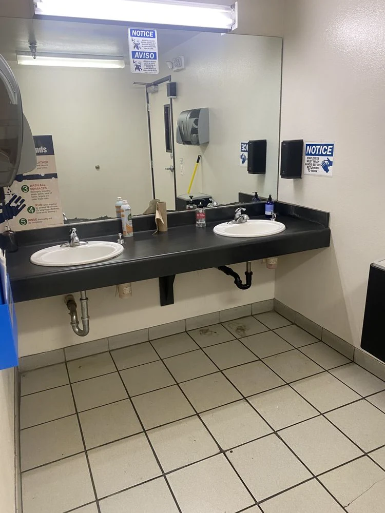 CH Cleaning Services — Commercial restroom with sinks and mirrors