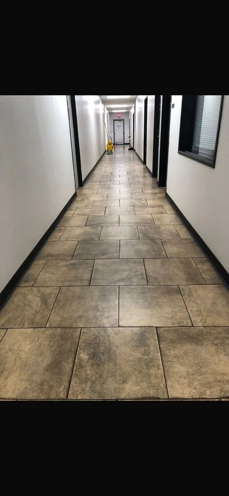 CH Cleaning Services — Long commercial hallway with tiled flooring