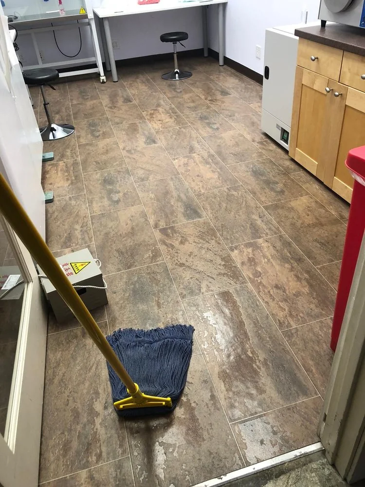 CH Cleaning Services — Tiled workroom floor with cleaning mop