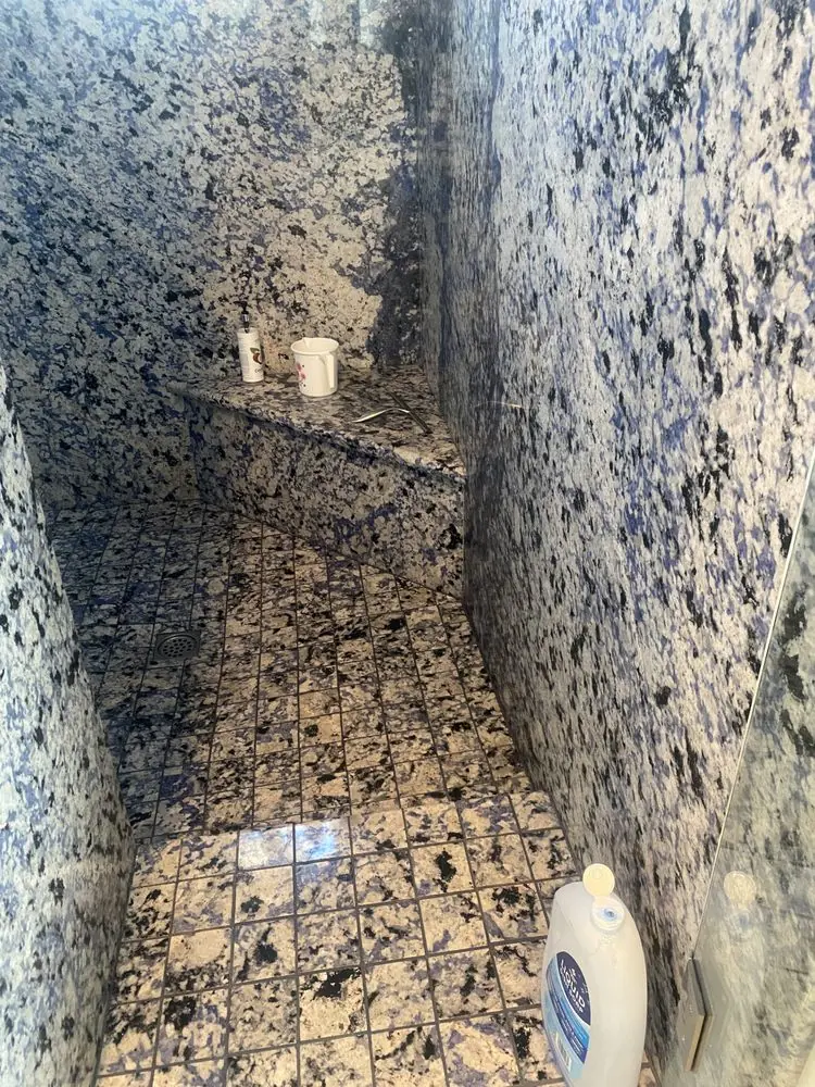CH Cleaning Services — Tiled shower stall with built-in bench