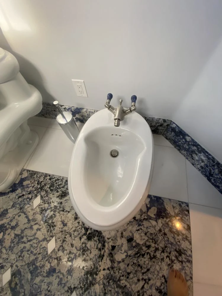 CH Cleaning Services — White bathroom with chrome fixtures