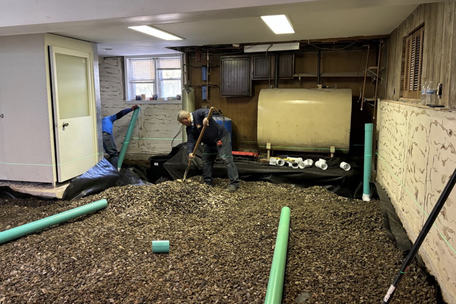 Waterproofing and drainage work on a residential foundation in Danbury, CT