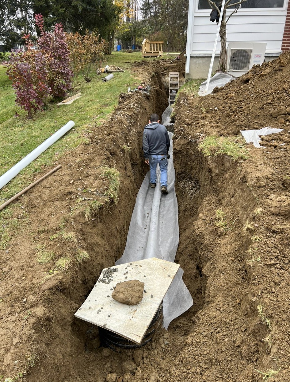 Whole-home waterproofing installation protecting a residential foundation and basement