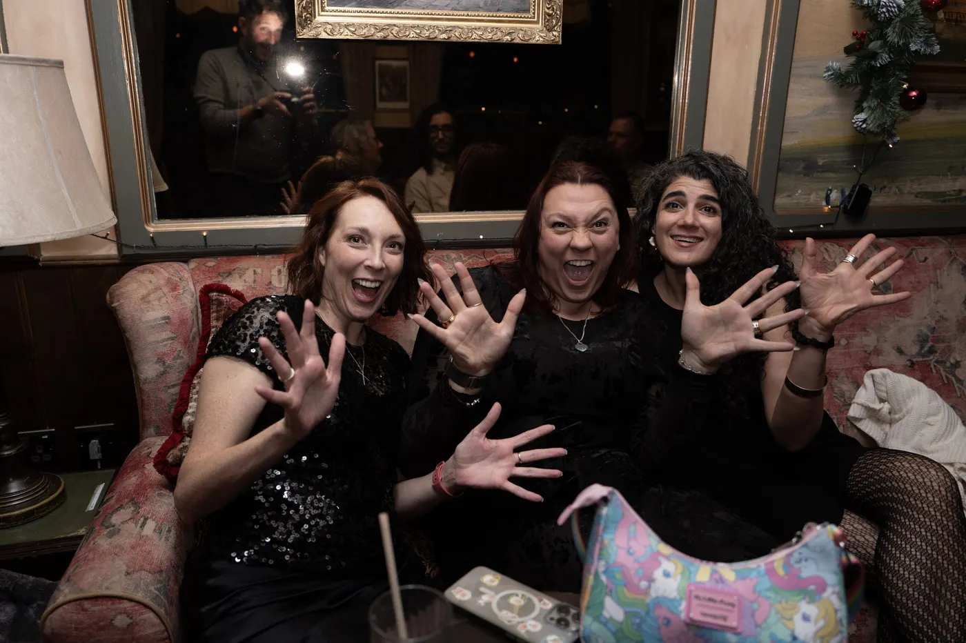 Members laughing together at the party
