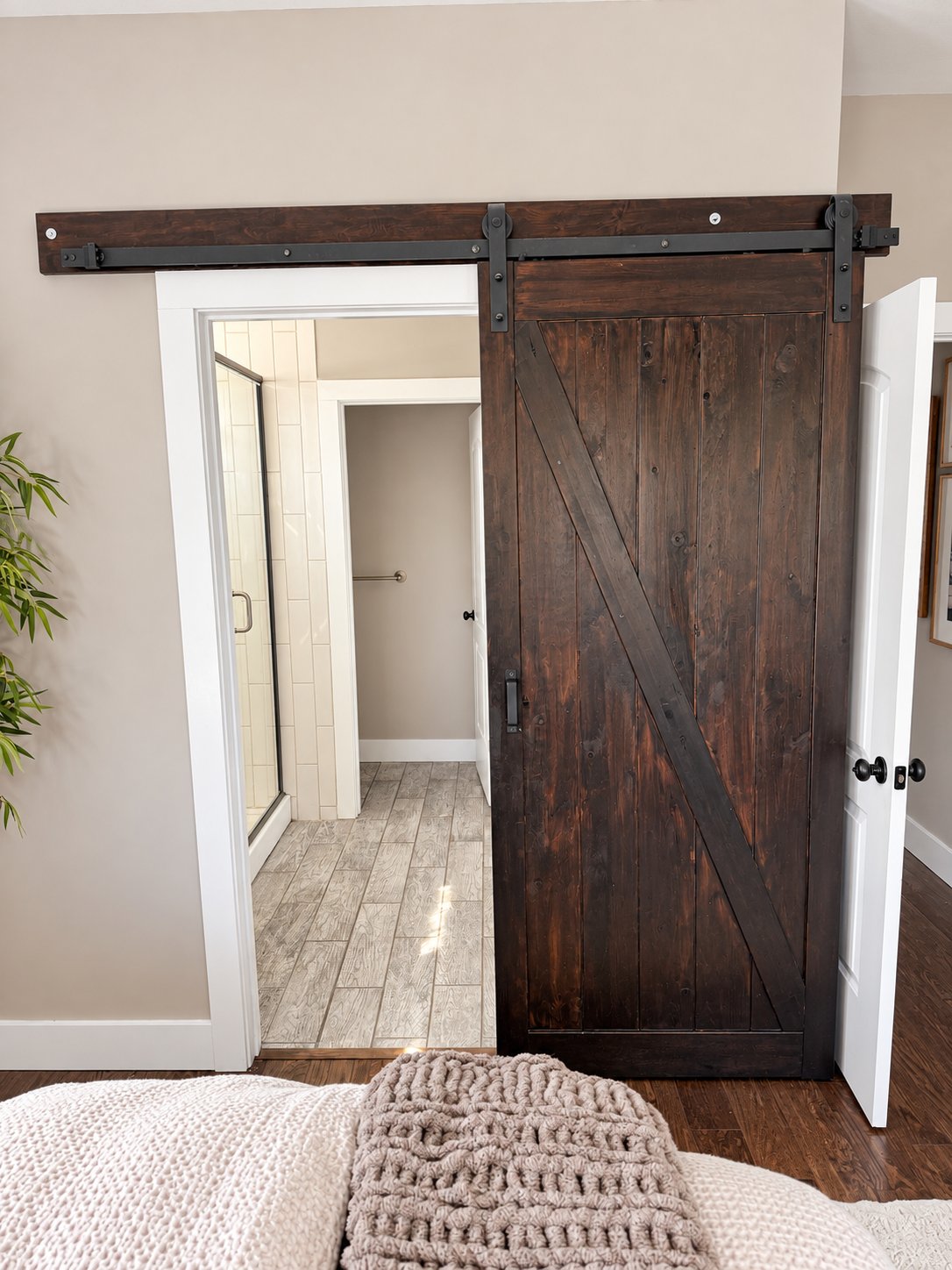 Sliding barn door into the primary bathroom